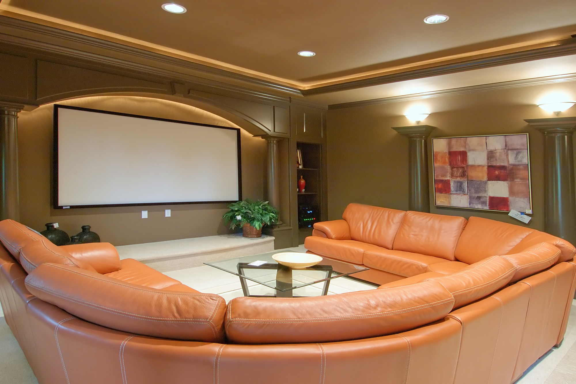 home theater room with wrap around couch