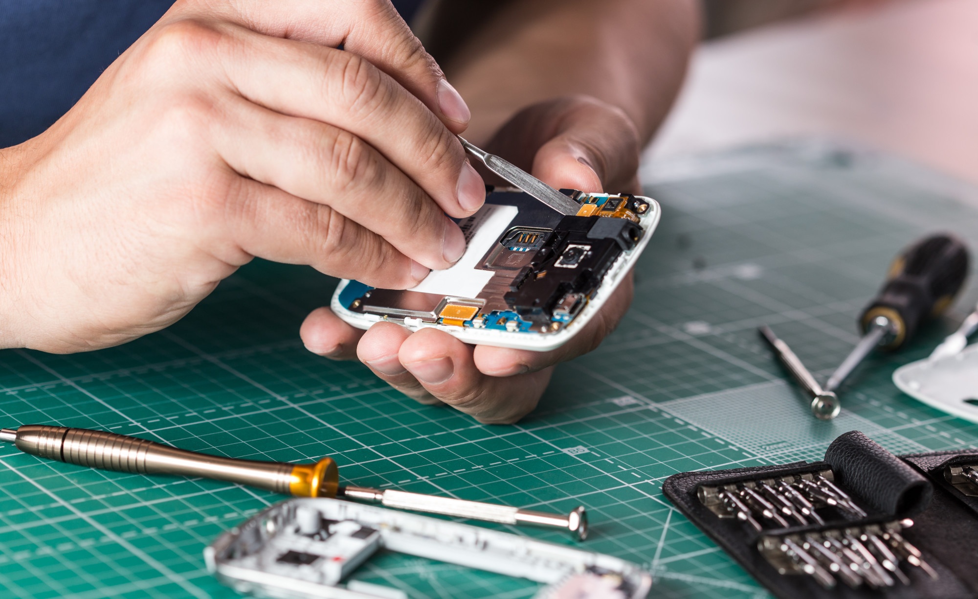 person repairing a phone