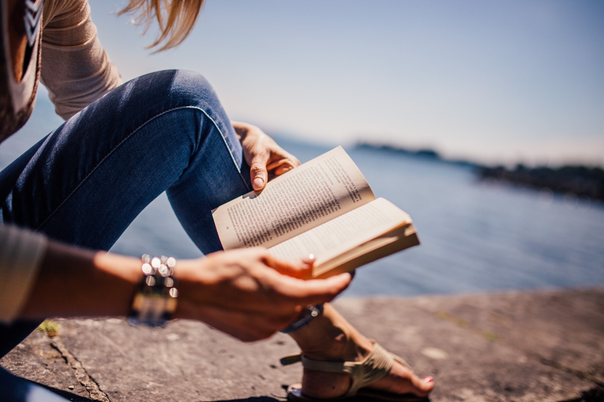 Woman Reading a Book Outdoors